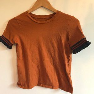 Zara shirt, orange color with frilled black sleeve